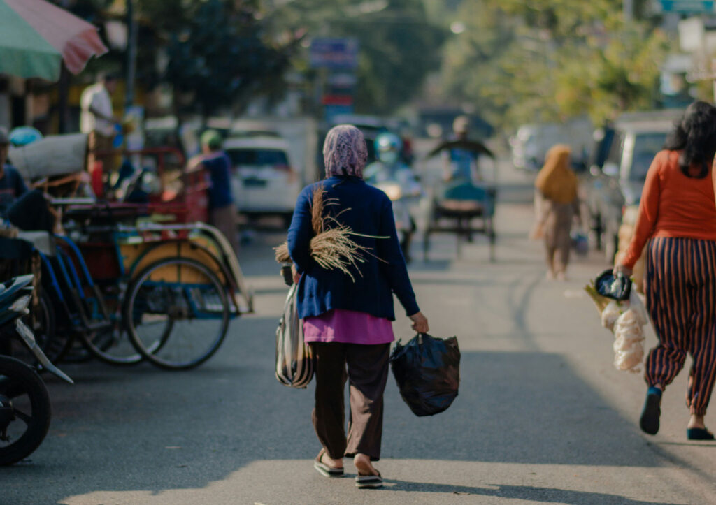 People walking on a busy street during the day