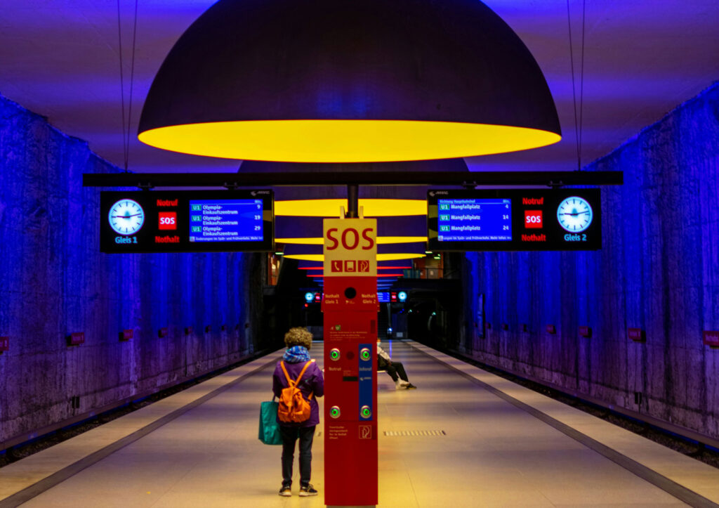 Person in colourful subway station