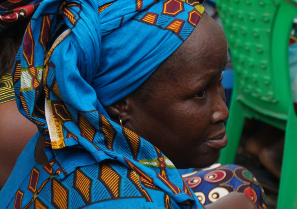 Woman in colourful blue and orange hijab