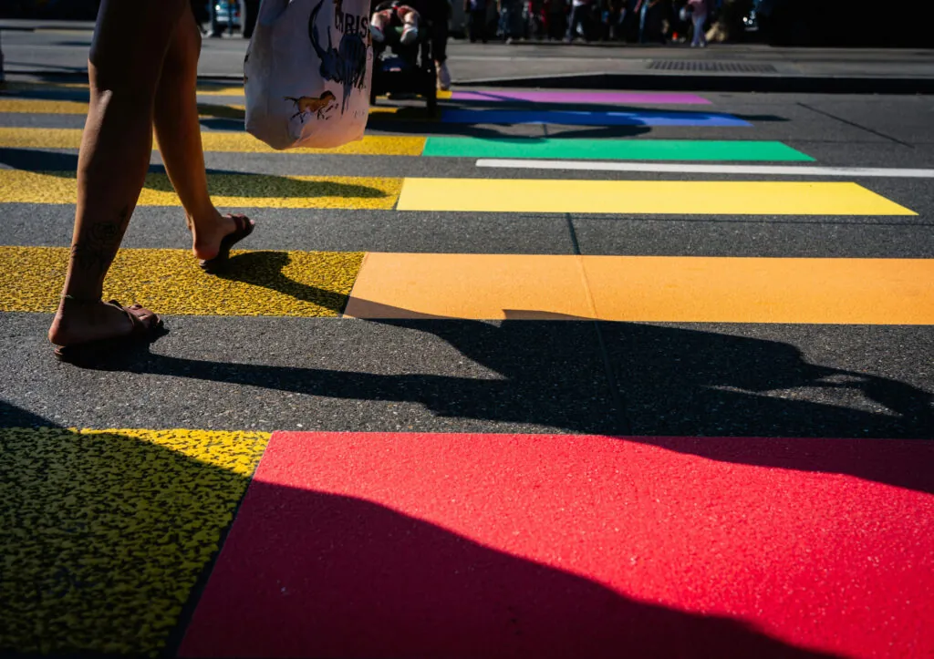 People walking on colourful pedestrian lane