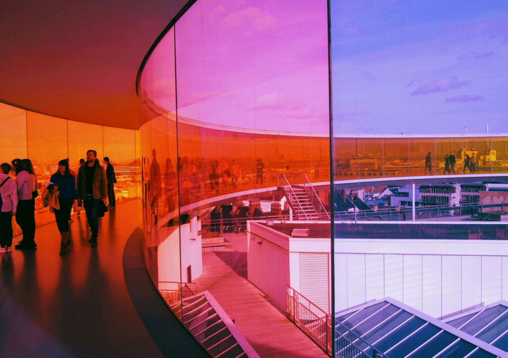 Group of people walking in colourful walkway