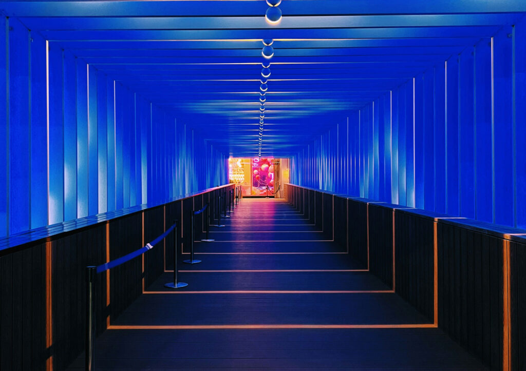 A long hallway with blue walls