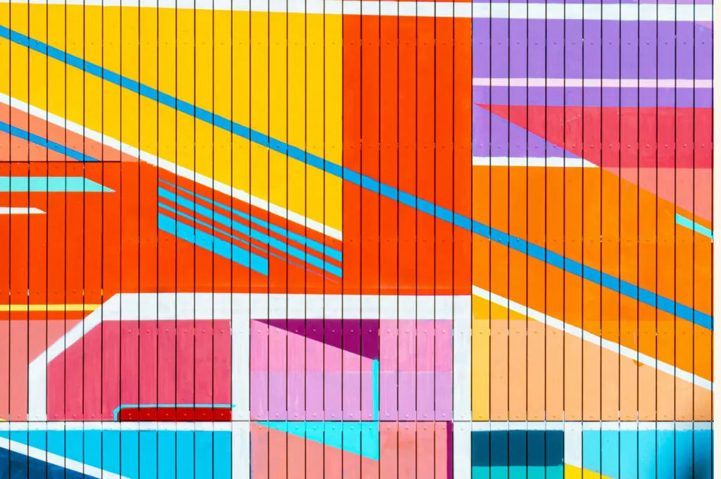 A multicoloured abstract painting on a wall